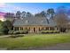 Traditional home boasting symmetrical design, dormer windows, dark shutters and meticulously maintained landscaping at 122 Lawn Market, Sharpsburg, GA 30277
