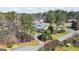 View of home featuring mature trees, shrubs and a well manicured lawn at 122 Lawn Market, Sharpsburg, GA 30277