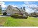 Lovely house with manicured lawn, garage, back porch, and mature landscaping at 122 Lawn Market, Sharpsburg, GA 30277