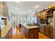 Spacious kitchen featuring a center island with a cooktop and granite countertops at 122 Lawn Market, Sharpsburg, GA 30277