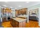 Spacious kitchen features a large island, stainless steel appliances, and wooden cabinets at 122 Lawn Market, Sharpsburg, GA 30277