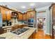 Well-equipped kitchen featuring granite countertops, stainless steel appliances, and ample wooden cabinetry at 122 Lawn Market, Sharpsburg, GA 30277