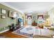 Spacious living room featuring hardwood floors and neutral-toned furniture at 122 Lawn Market, Sharpsburg, GA 30277