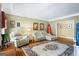 Cozy living room featuring hardwood floors and neutral-toned furniture at 122 Lawn Market, Sharpsburg, GA 30277