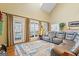 Bright living room with fireplace, plush seating, and access to an outdoor balcony at 122 Lawn Market, Sharpsburg, GA 30277