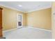 An empty room with neutral walls, white trim, and a glass-paned door to the outside at 122 Lawn Market, Sharpsburg, GA 30277