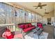Inviting sunroom with cozy seating, perfect for enjoying the natural light and outdoor views at 122 Lawn Market, Sharpsburg, GA 30277