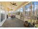 Relaxing sunroom with screened windows overlooking the trees and backyard with ample space and natural light at 122 Lawn Market, Sharpsburg, GA 30277