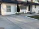 Charming single-story home featuring a long driveway and a well-maintained, freshly painted white brick and siding exterior at 4100 Scott S Dr # 0, Forest Park, GA 30297