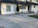 Charming single-story home featuring a long driveway and a well-maintained, freshly painted white brick and siding exterior at 4100 Scott S Dr # 0, Forest Park, GA 30297