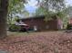 Spacious backyard featuring a covered patio area, perfect for outdoor entertaining and relaxation at 6826 Mayo Dr, Riverdale, GA 30274