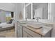 Bathroom features double vanities, granite counters, vessel sinks, and framed LED mirrors at 223 Ivey Ter # 34, Temple, GA 30179