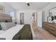 Bedroom with bed and nightstand, showing doors to the bathroom and hallway at 223 Ivey Ter # 34, Temple, GA 30179