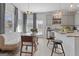 Dining area with modern chandelier, seating, and access to the kitchen and patio at 223 Ivey Ter # 34, Temple, GA 30179