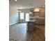 Open view of kitchen featuring island, pendant lights, and stainless steel appliances at 223 Ivey Ter # 34, Temple, GA 30179