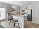 Well-lit kitchen featuring granite countertops, stainless steel appliances, and ample cabinetry at 223 Ivey Ter # 34, Temple, GA 30179