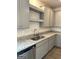 Kitchen features stainless steel appliances, granite countertops, modern fixtures and gray cabinetry at 223 Ivey Ter # 34, Temple, GA 30179