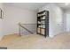 Upstairs landing area with railing and stylish bookcase at 223 Ivey Ter # 34, Temple, GA 30179