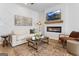 Cozy living room showcasing fireplace, decor, neutral color palette, and abundant light at 223 Ivey Ter # 34, Temple, GA 30179