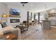 Open concept living space with fireplace, dining area, and kitchen island at 223 Ivey Ter # 34, Temple, GA 30179