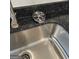 Stainless steel kitchen sink with modern chrome faucet and granite countertops at 223 Ivey Ter # 34, Temple, GA 30179