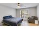 Relaxing bedroom featuring a comfortable bed, natural light, and a cozy seating area at 4864 Yeagar Rd, Douglasville, GA 30135