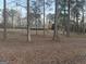 Charming single-level home with a deck, surrounded by a wooded landscape, sitting away from the road at 4864 Yeagar Rd, Douglasville, GA 30135