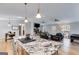 Spacious kitchen with island bar seating flows into a comfortable living area with fireplace at 4864 Yeagar Rd, Douglasville, GA 30135