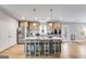 Modern kitchen boasts a large island with seating, stainless steel appliances, and wood flooring at 4864 Yeagar Rd, Douglasville, GA 30135