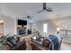 Cozy living room with a stone fireplace, comfortable seating, and natural light at 4864 Yeagar Rd, Douglasville, GA 30135