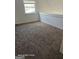 Simple bedroom with carpet flooring, natural light from a window, and potential for personalization at 11187 Shannon Cir, Hampton, GA 30228