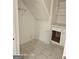 Storage area with tiled floors, built-in shelving, and cabinets at 11187 Shannon Cir, Hampton, GA 30228