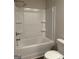 Bright bathroom featuring a shower-tub combination and white tile surround at 227 Ivey Ter # 36, Temple, GA 30179