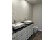 Bathroom featuring double sinks and a modern toilet that complement the neutral color palette at 227 Ivey Ter # 36, Temple, GA 30179