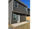 Exterior view of backyard with concrete patio, new fence and nice lawn at 229 Ivey Ter # 37, Temple, GA 30179