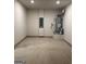 Unfinished basement featuring a water heater and an electrical panel at 229 Ivey Ter # 37, Temple, GA 30179