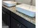 Bathroom featuring a black vanity cabinet, granite countertop, and vessel sinks at 229 Ivey Ter # 37, Temple, GA 30179