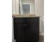 Bathroom vanity features dark cabinets and granite countertop at 229 Ivey Ter # 37, Temple, GA 30179