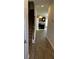 Inviting entryway with wood-look flooring, staircase, and a view into the modern kitchen at 229 Ivey Ter # 37, Temple, GA 30179