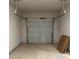 A one car garage with modern door, concrete floor and storage space at 229 Ivey Ter # 37, Temple, GA 30179