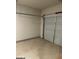 Empty garage with a roll up door and concrete flooring at 229 Ivey Ter # 37, Temple, GA 30179
