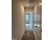 Hallway with carpeted floors leading to bedroom at 229 Ivey Ter # 37, Temple, GA 30179