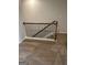 Hallway overlooking the staircase with wood railing and black iron balusters at 229 Ivey Ter # 37, Temple, GA 30179