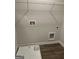 A laundry room featuring wood-look flooring, painted walls, and a white utility sink at 229 Ivey Ter # 37, Temple, GA 30179
