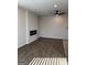 Living room features a sleek fireplace, ceiling fan and wood-look flooring at 229 Ivey Ter # 37, Temple, GA 30179