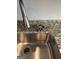 Stainless steel sink features a modern faucet, granite countertop, and glass rinser at 229 Ivey Ter # 37, Temple, GA 30179