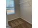 Walk-in closet featuring carpet and a storage shelf by the window at 229 Ivey Ter # 37, Temple, GA 30179