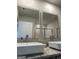 Stylish bathroom mirrors above and sinks and granite counters, reflecting modern design and ample space at 233 Ivey Ter # 39, Temple, GA 30179