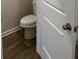Powder room featuring white fixtures and wood-look flooring at 233 Ivey Ter # 39, Temple, GA 30179