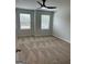 Bedroom with two windows, carpet, and ceiling fan at 233 Ivey Ter # 39, Temple, GA 30179